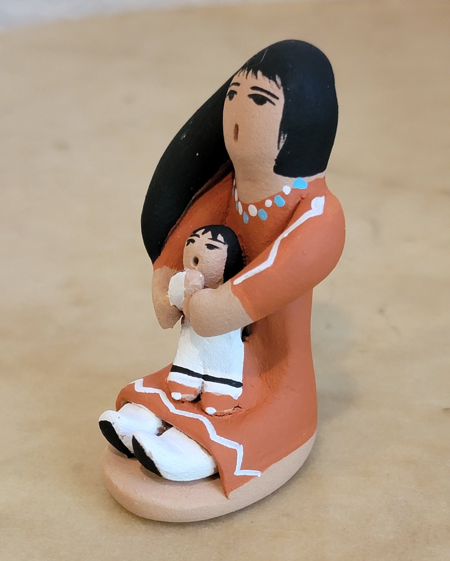 Angie Loretta Jemez Storyteller w/ One Child Pueblo Pottery